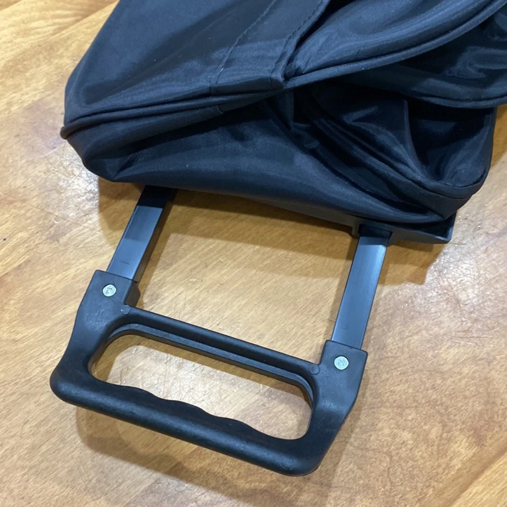 NWOT. Nylon rolling carry-on bag.